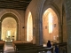 Photo suivante de Archignac Eglise saint-Etienne : La nef avec un collatéral voûté d'ogives ajoutée au XVIe siècle.