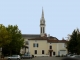 Photo suivante de Neuvic facades-des-maisons .Clocher de l'église-saint-pierre-et-saint-paul-origine-romane-remaniee-par-la-suite