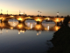 Photo suivante de Bordeaux Le pont de pierre à la tombée de la nuit.