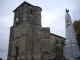 L'église romane (IMH) et le monument aux morts.