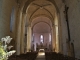 Photo précédente de Saint-Ferme la-nef-vers-le-choeur-de-l'église notre dame de la nativité.