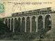 Le Viaduc des Pourris, 92 mètres de long, 16 mètres de haut - Ligne Saint-Brieuc à Plouha - Passage du Train (carte postale de 1907)