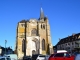 Photo suivante de Le Neubourg L'église Saint-Pierre-Saint-Paul. La façade ouest est flanquée de deux tours percées d'une rose.