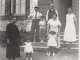 Photo suivante de Les Damps Ma maman âgée de 2 ans tenue par sa grand mère et à droite, sa mère et institutrice Renée Cornet devant l'école des Damps