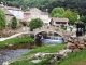 Photo précédente de Saint-Geniès-de-Varensal le pont et les maisons près de la rivière