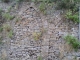 Photo suivante de Arnac-sur-Dourdou Mur de soutènement avec mur en pierres sèches à l’intérieur des ogives permettant l’écoulement de l’eau.