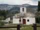 Photo précédente de Riboux l'église dans son décor de montagne
