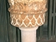 Le bénitier en pierre, taillé dans un chapiteau gallo-romain.