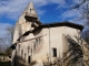 Le chevet et son clocher-mur de l'église Notre-Dame de Lussolle du XIIIe siècle.