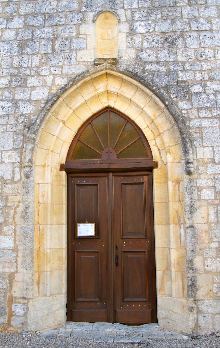 Le portail de l'église. - Tourliac