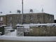Photo suivante de Besneville L'école des garçons et la mairie de Besneville sous la neige