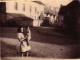 photo de moi en avril 1948 devant l'école et la mairie avec ma marraine Marie Collot devenue Marie DUBREUIL 