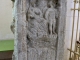 Autel votif gallo-romain découvert en 1856 dans le sol, lors de la démolition de l'église romane. Face gauche Nord.