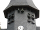 Détails du clocher avec ses deux petites cloches d'horloge