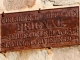 Photo suivante de Brignac-la-Plaine Ancien panneau accolé au mur de l'église.