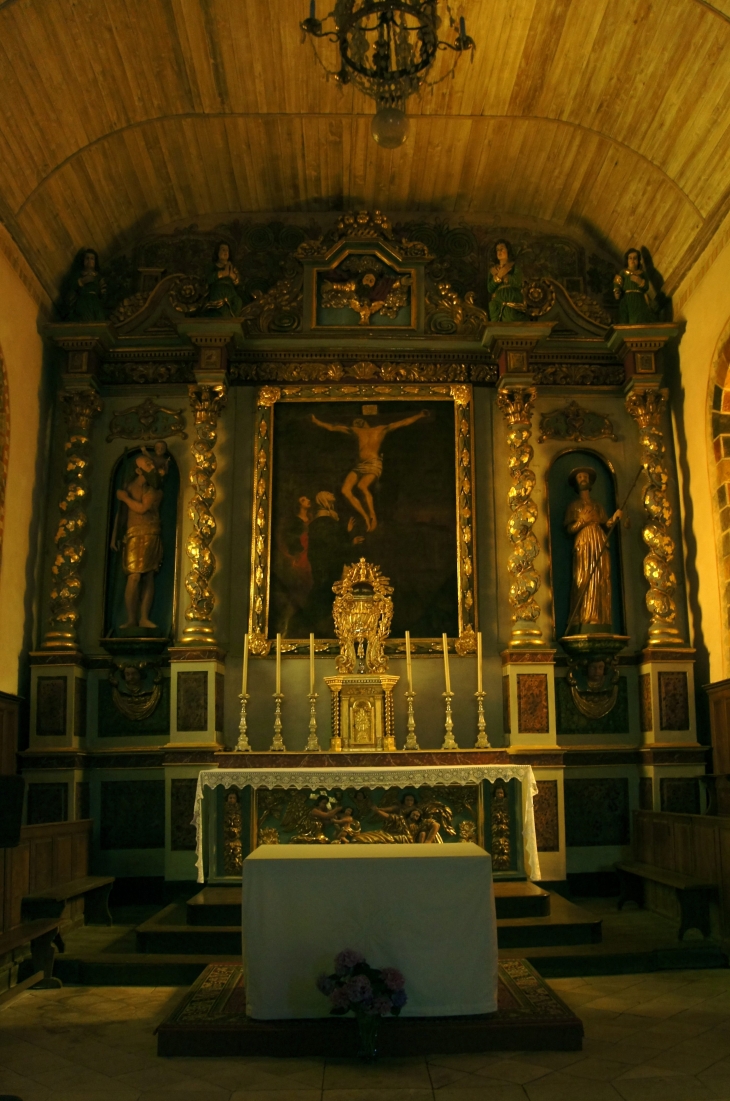 Le retable de style baroque du XIXe siècle. Eglise Saint Christophe. - Voutezac