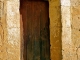 Eglise Romane Saint Michel: petite porte de la façade Sud avec son ancien Chrisme roman