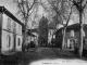 Entrée du village de Lunel, début XXe siècle (carte postale ancienne)