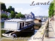Les bateaux lavoirs au bord de la Mayenne (carte postale).