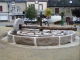 Photo suivante de Saint-Pierre-des-Nids Reconstitution d'une meule ancienne pour decorer la place du village.