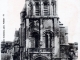 L'église Sainte Radegonde - Le clocher du XIe siècle et son entrée ouest du XVe siècle, vers 1920 (carte postale ancienne).